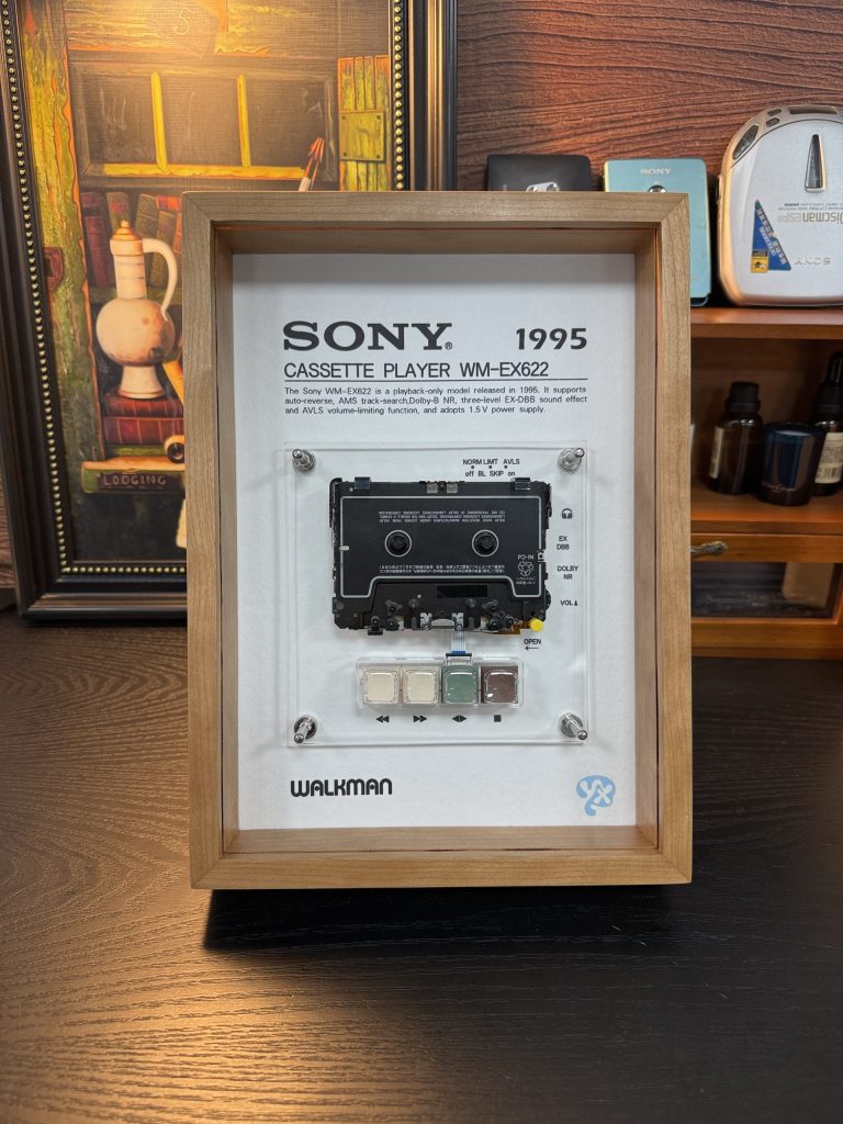 Sony Walkman WM-EX622 framed in solid wood, standing upright on a desk