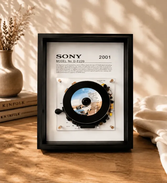 Restored vintage CD players and Discmans in wooden frames