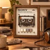 Sony Walkman WM-EX610 Cassette Frame - restored vintage cassette player in a walnut wooden display frame on a desk with headphones and a lamp