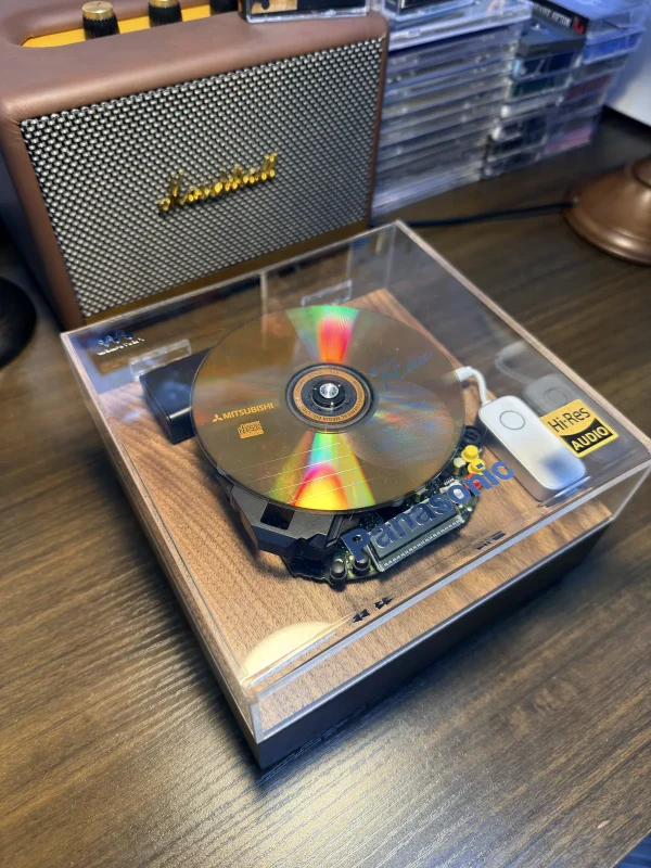 sony-discman-d-350-cd-frame-angle Panasonic SL-S230 CD Frame — angled view showing the wood frame and acrylic cover, ID: attachment_alt